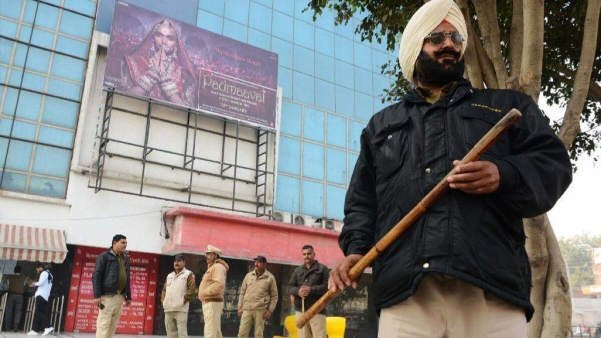 Indian policemen stand guard outside a cinema hall scheduled to screen "Padmaavat' in Amritsar, India, on Jan. 25.