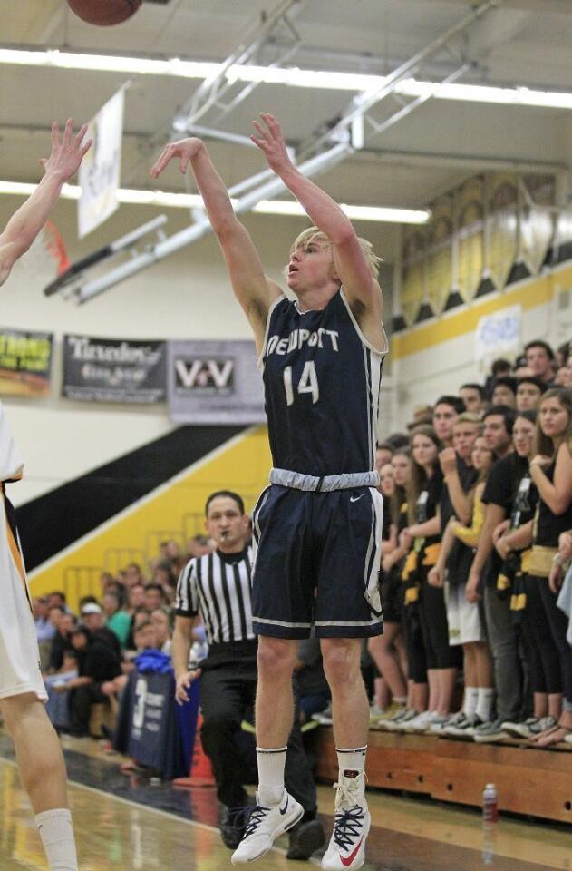 Newport Harbor High's Nic Sargeant (14) scores on a three-pointer during the first half against Foothill in a CIF Southern Section Division 2AA first-round playoff game on Friday.