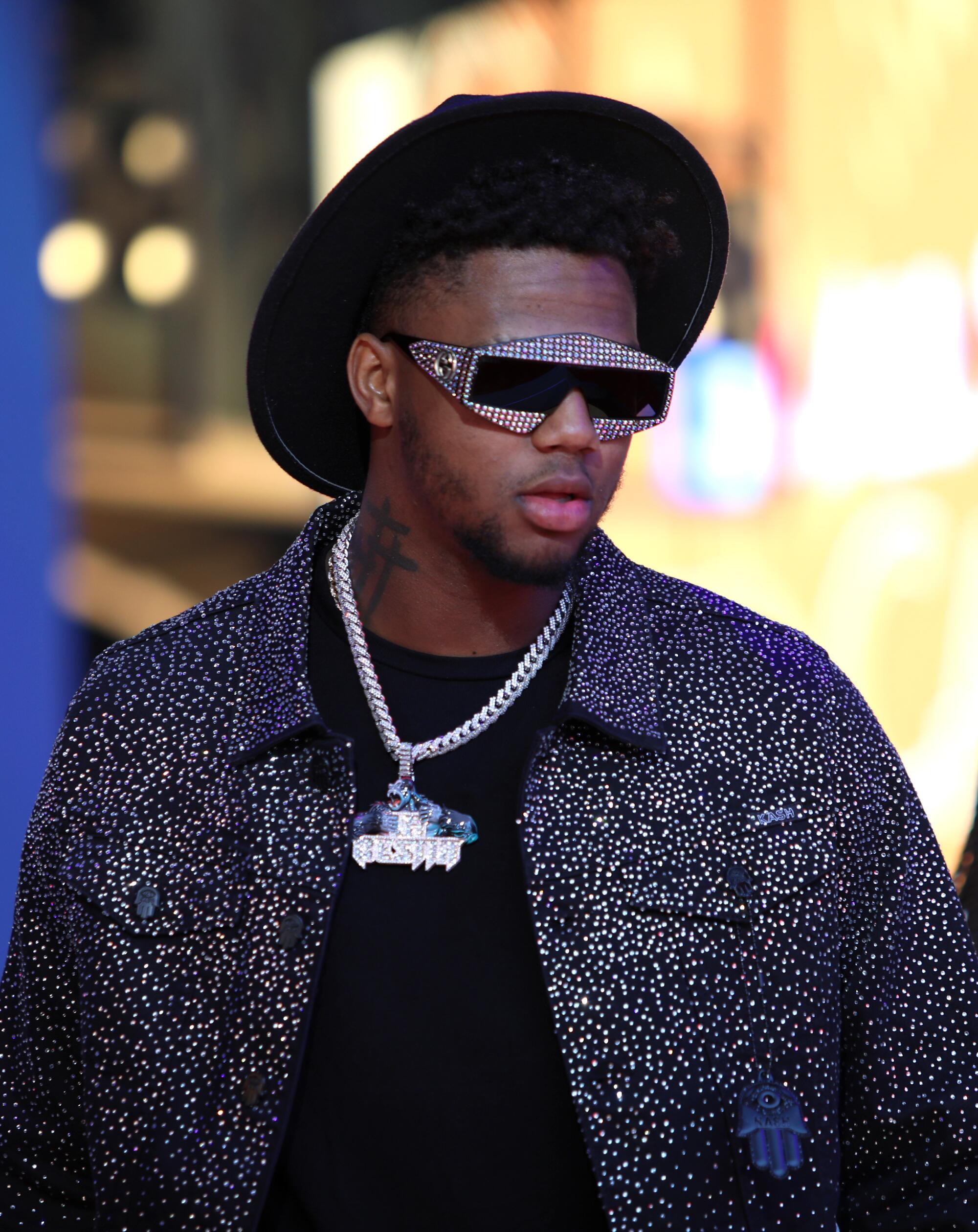 Ronald Acuna Jr. in a black and silver jacket arrives at the 2022 MLB All-Star Game Red Carpet Show.