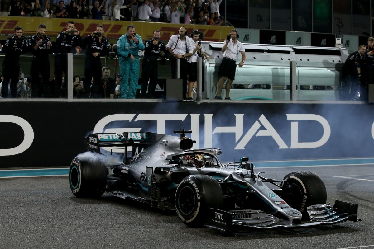 Lewis Hamilton of Great Britain celebrates with donuts on track during the F1 Grand Prix of Abu Dhabi at Yas Marina Circuit on Dec. 01.