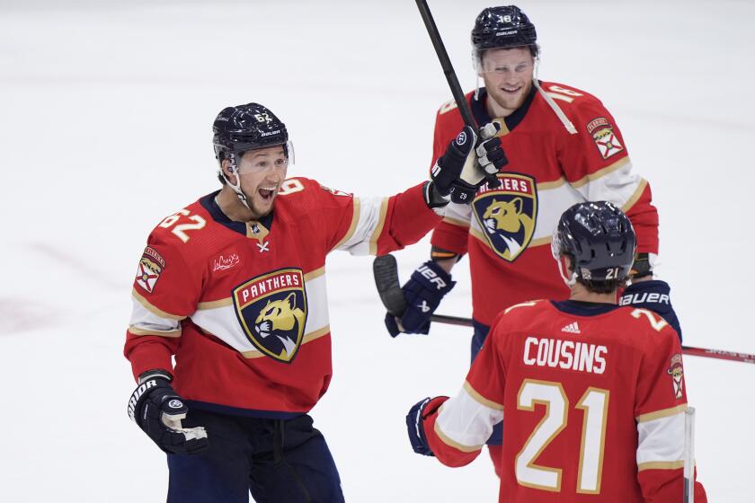 Florida Panthers defenseman Brandon Montour (62) center Nick Cousins (21) and center Steven Lorentz (18) celebrate after the Panthers beat the Tampa Bay Lightning Game 5 of the first-round of an NHL Stanley Cup Playoff series, Monday, April 29, 2024, in Sunrise, Fla. (AP Photo/Wilfredo Lee)