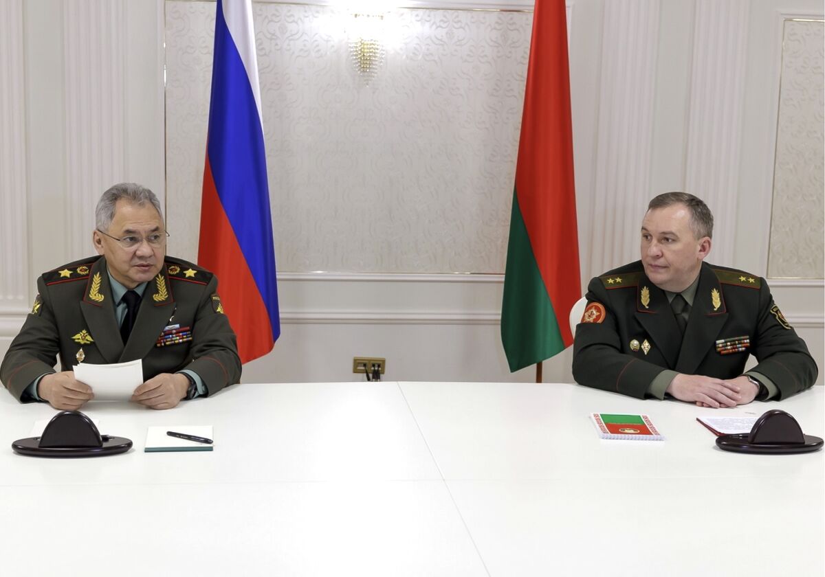 Russian Defense Minister Sergei Shoigu and Belarusian Defense Minister Viktor Khrenin speak to media in Minsk on Thursday.