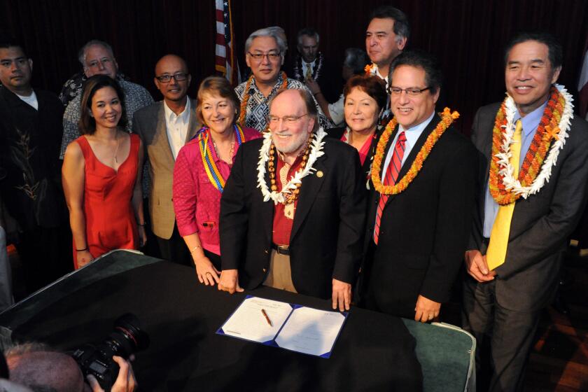 Gov. Neil Abercrombie, center, with legislators and supporters in Honolulu after he signed a bill legalizing gay marriage in Hawaii.