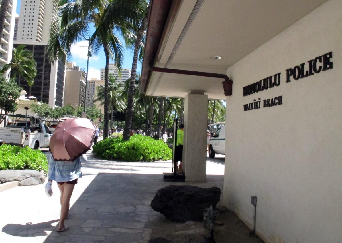 The Honolulu Police Department argued that if undercover police are no longer allowed to have sex with prostitutes, then prostitutes would be able to change their tactics and filter out officers. Above, a pedestrian in front of a Honolulu police station.
