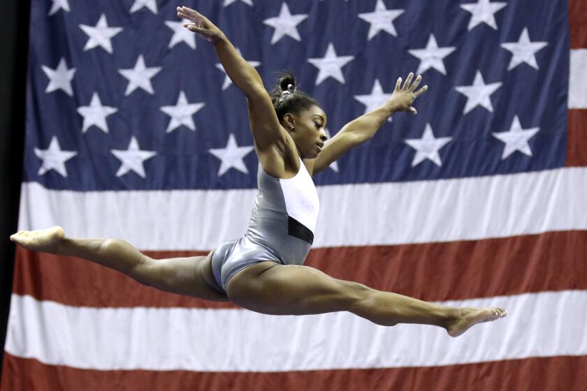 Simone Biles works on the beam during practice for the U.S. gymnastics championships Wednesday, Aug. 7, 2019, in Kansas City, Mo. (AP Photo/Charlie Riedel)