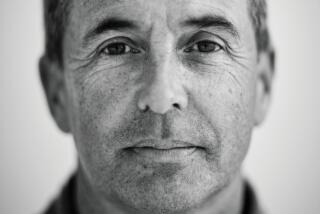 A black and white photo of Don Winslow looking into the camera.