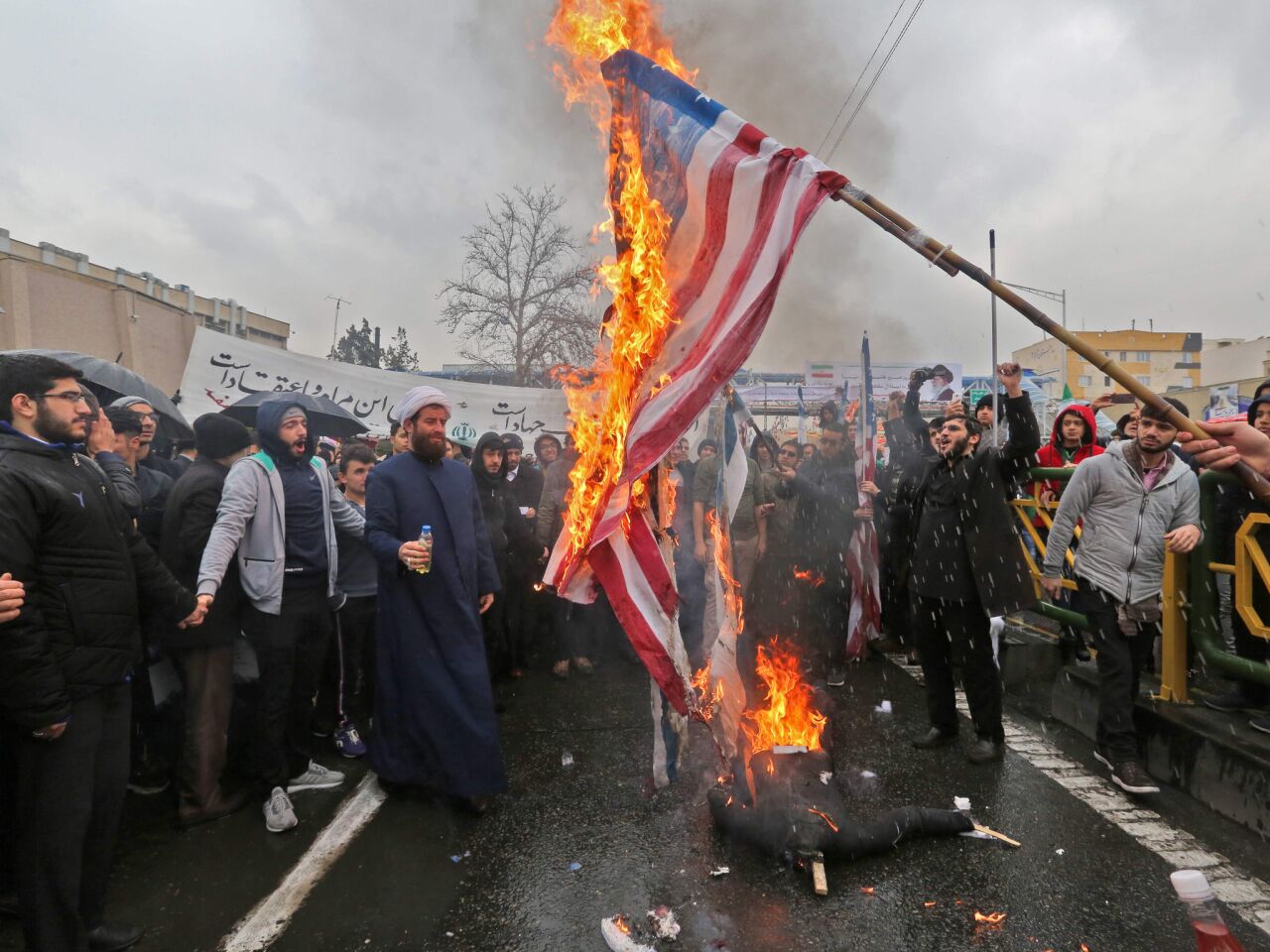 Iranians burn American flags during commemorations of the 40th anniversary of the Islamic Revolution in Tehran.