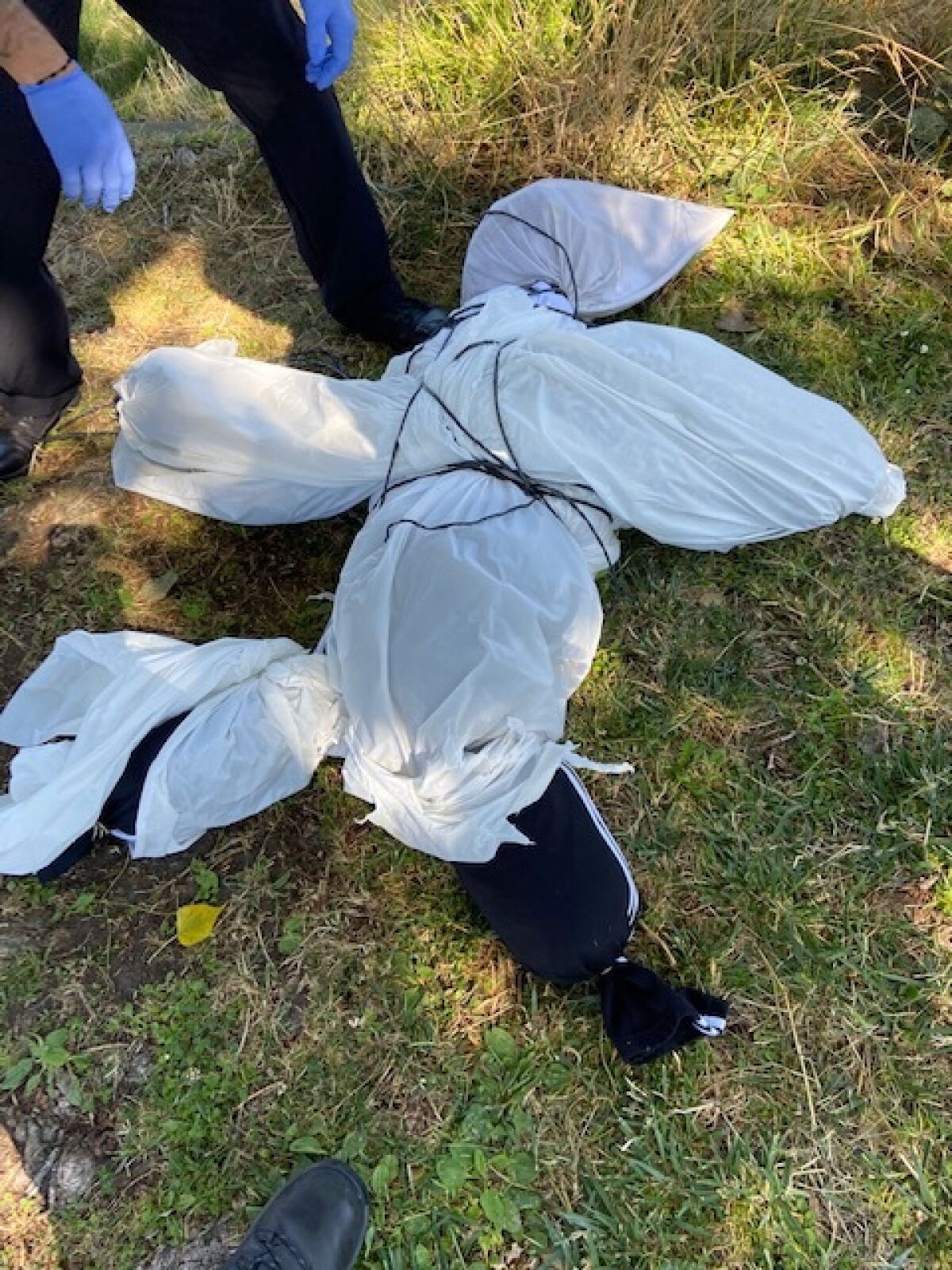 The effigy found at Lake Merritt in Oakland was wearing black sweatpants.
