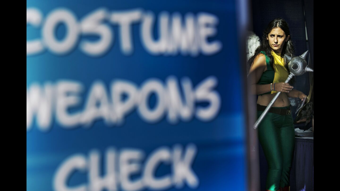 A cosplayer stops by the weapons check station early in Day 2 of Comic-Con 2016 at the San Diego Convention Center.