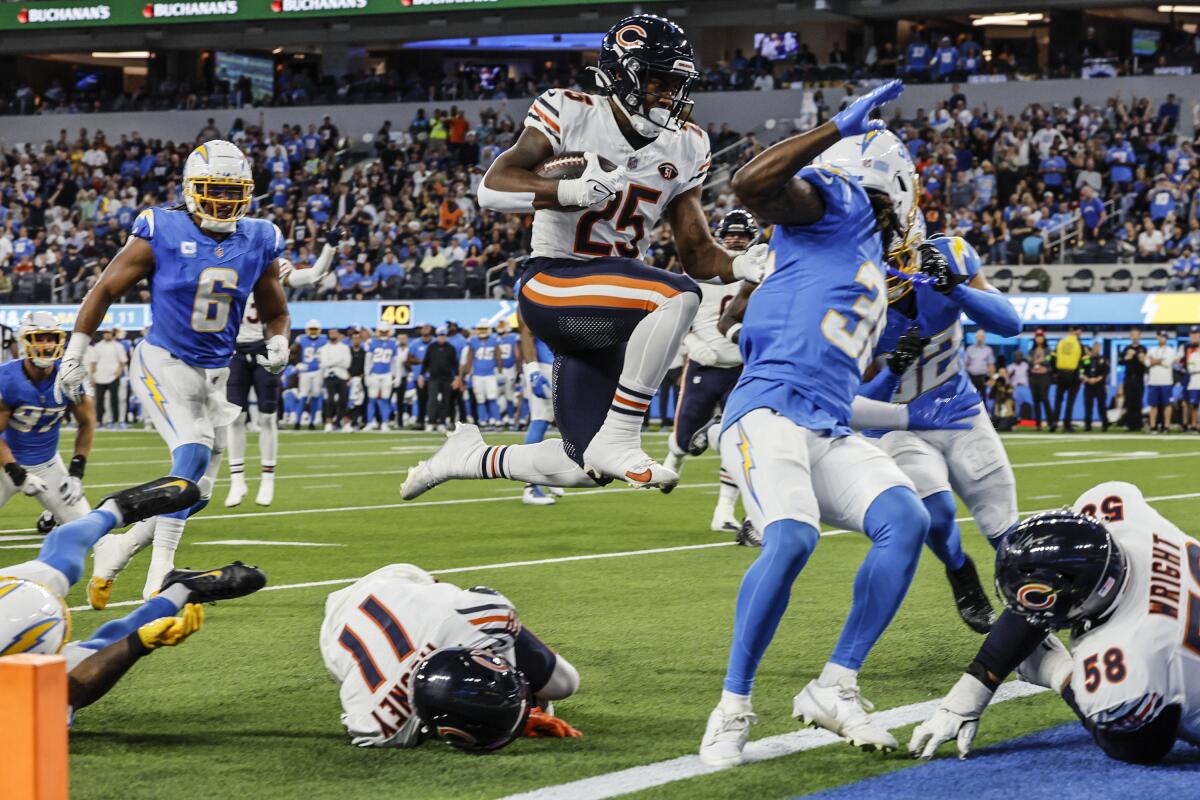 Chicago Bears running back Darrynton Evans leaps into the end zone for a touchdown in the second quarter.