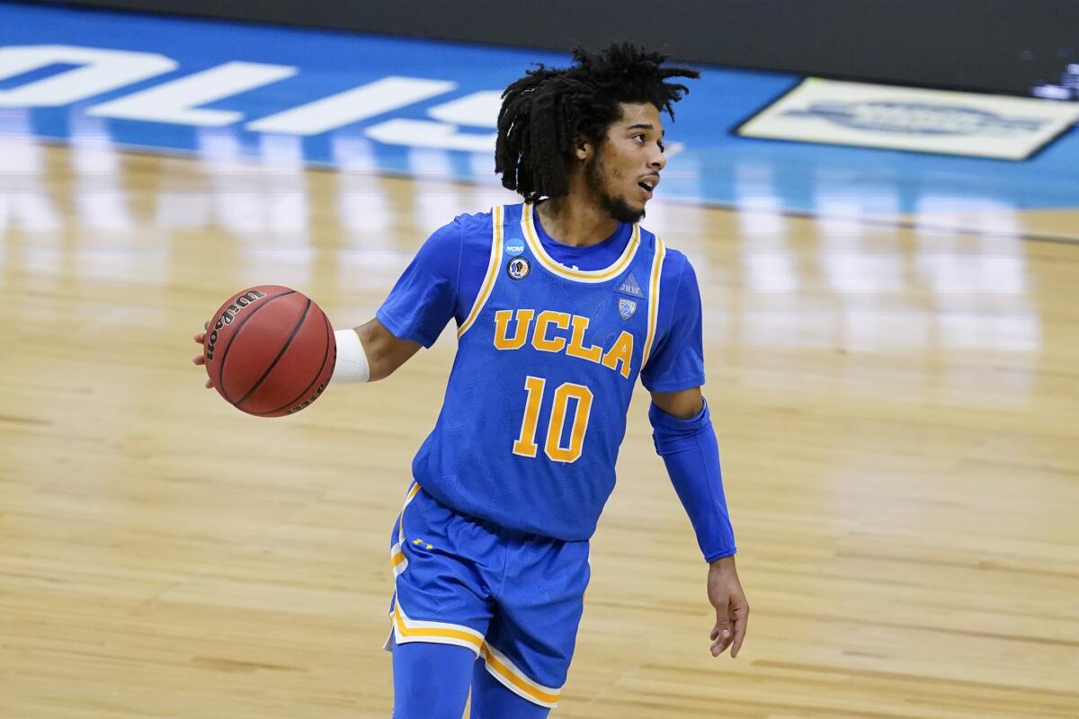 UCLA guard Tyger Campbell controls the ball against Michigan on Tuesday.