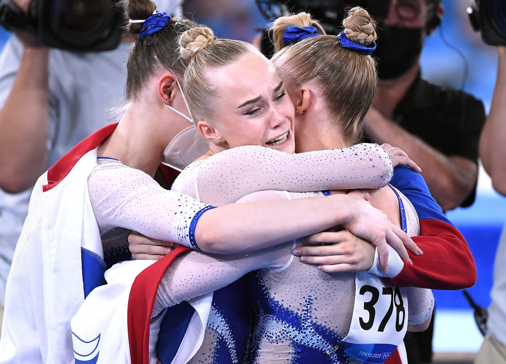 Members of the Russian team celebrate winning the gold medal in the women's gymnastics team final at the Tokyo Olympics.