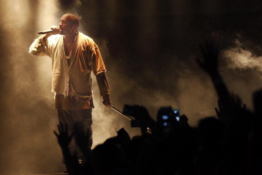 Kanye West performs at FYF Fest on Sunday.
