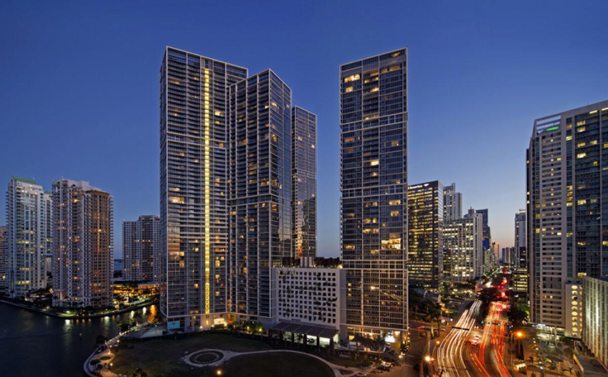 The luxurious three-tower Icon Brickell complex lights up the Miami skyline.