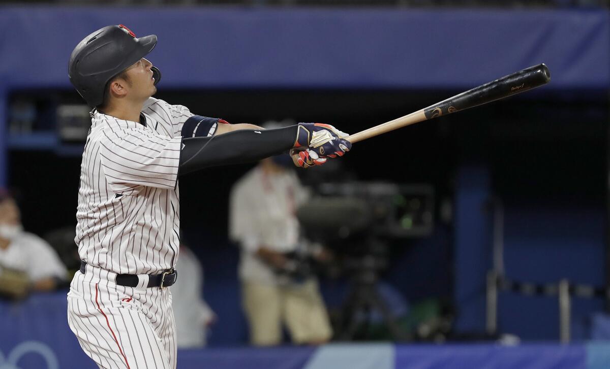 Japan's Selya Suzuki hits a home run during the fifth inning of a 7-6 victory over the United States.