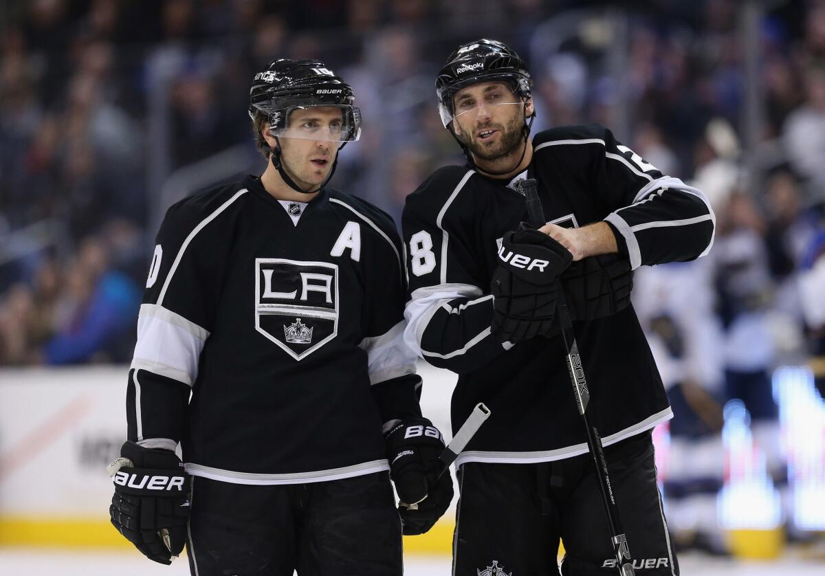 Former Kings Mike Richards (10) and Jarret Stoll (28) talk during a 2013 game against the Blues.