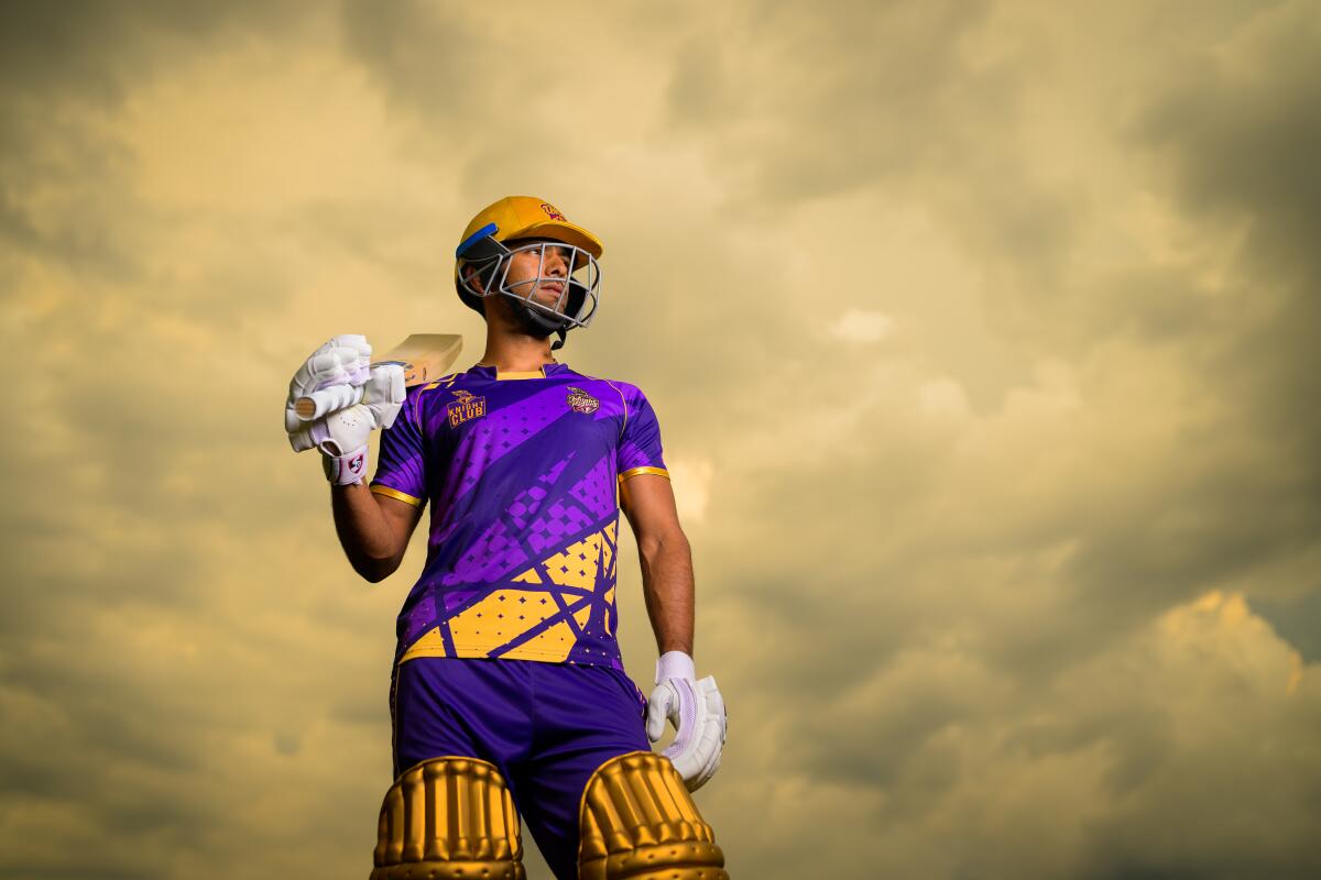 Unmukt Chand, of the L.A. Knight Riders, poses for a photograph with a cricket bat in Dallas, Texas.