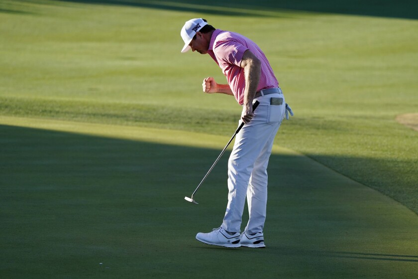 Hudson Swafford pumps his fist after making a putt for par on the 18th hole during the final round of the American Express golf tournament on the Pete Dye Stadium Course at PGA West, Sunday, Jan. 23, 2022, in La Quinta, Calif. (AP Photo/Marcio Jose Sanchez)
