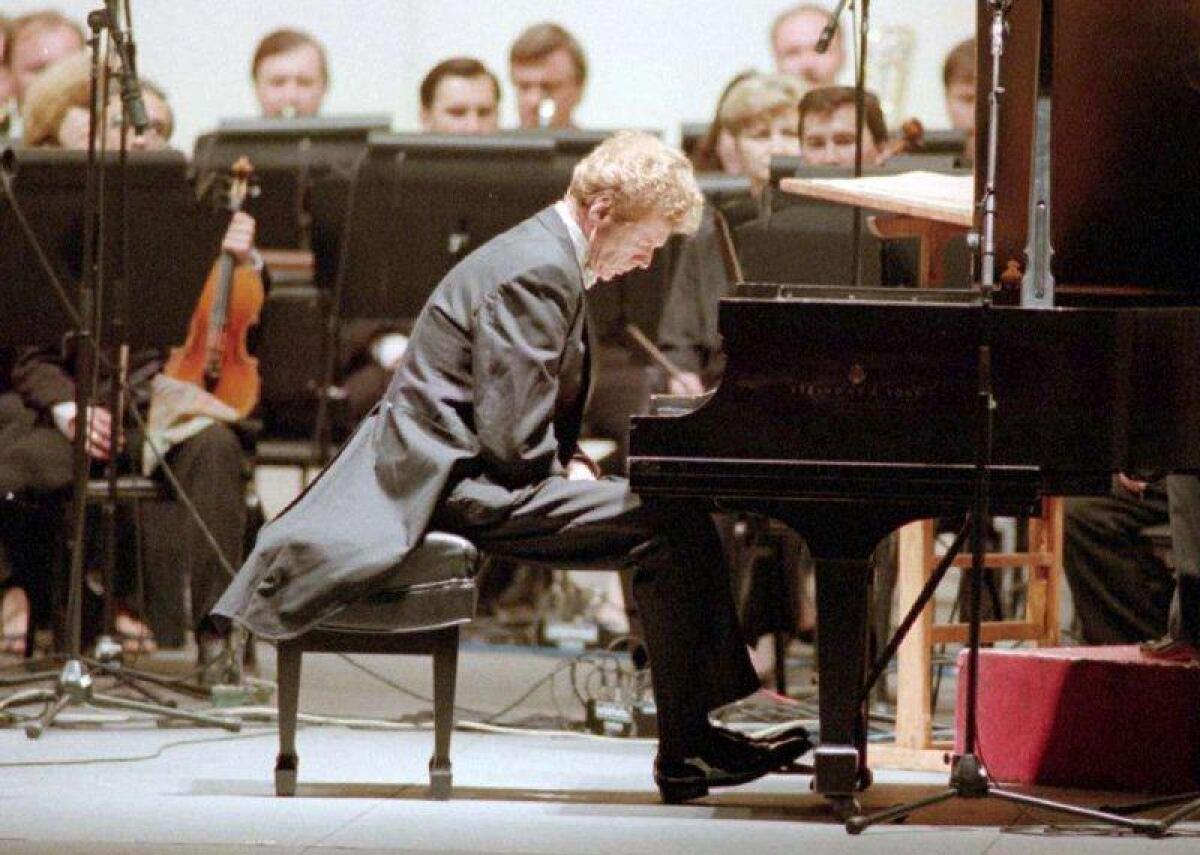Van Cliburn pauses before performing an "encore" piece during an appearance at the Hollywood Bowl.