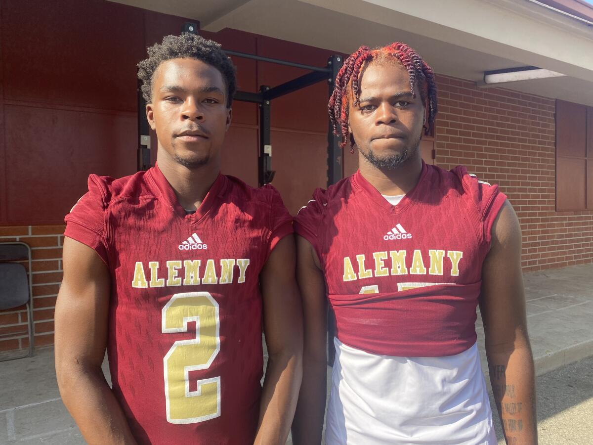 Former St. Bernard receiver Larry Turner with new Bishop Alemany teammate Kevin Green.