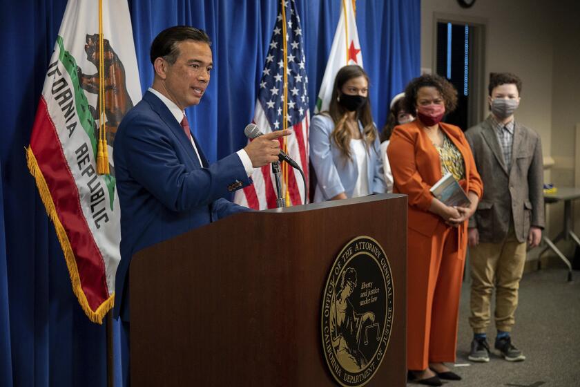 Attorney General Rob Bonta speaks after he was sworn in as California's 34th Attorney General as his wife Mia Bonta and children Reina, Iliana and Andres watch during a ceremony, Friday, April 23, 2021 in Sacramento, Calif. Bonta, 49, will become the first Filipino American to head the Department of Justice. (Paul Kitagaki Jr./The Sacramento Bee via AP, Pool)