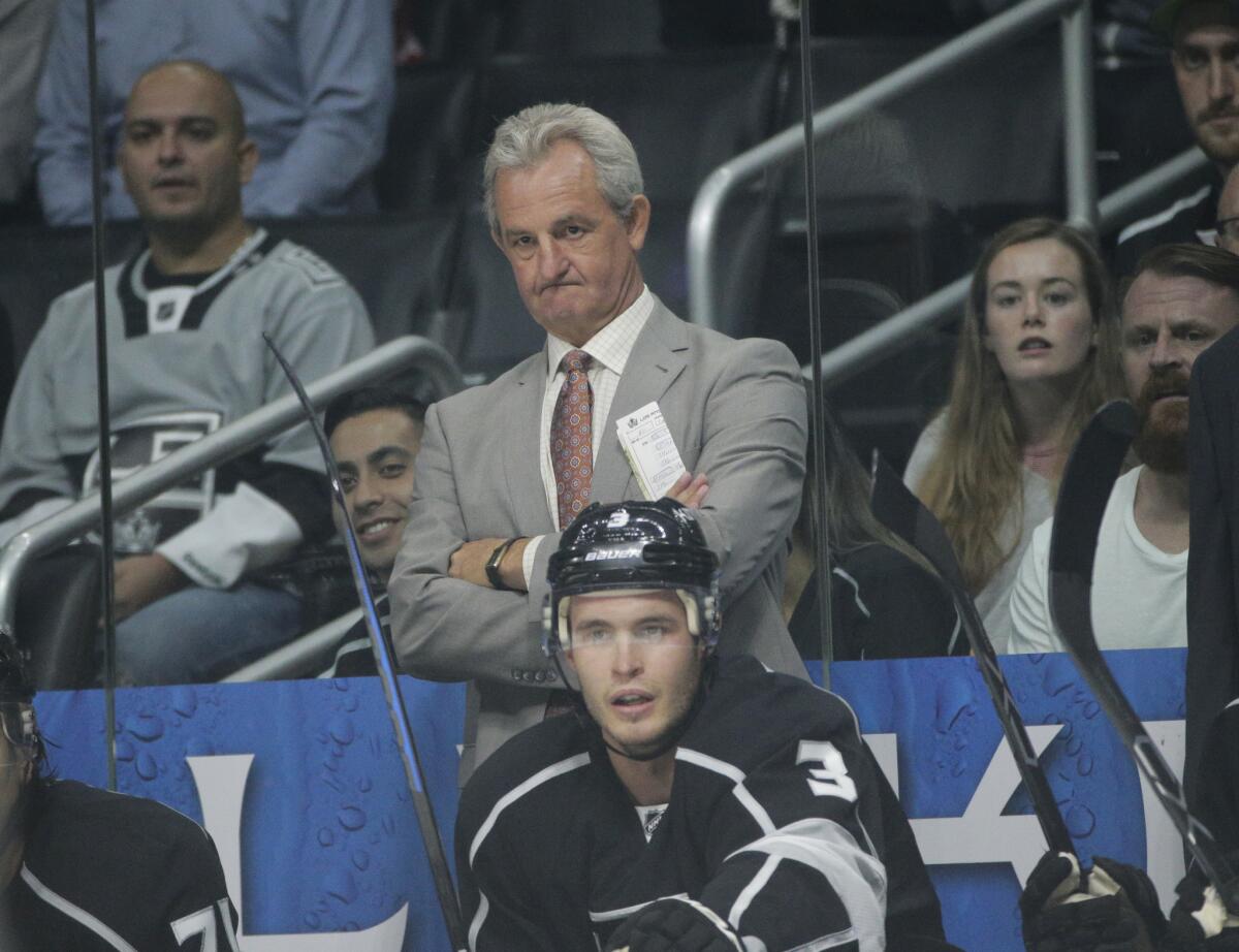 Kings Coach Darryl Sutter watches from the bench during the first period of a game against the Arizona Coyotes on Oct. 9.