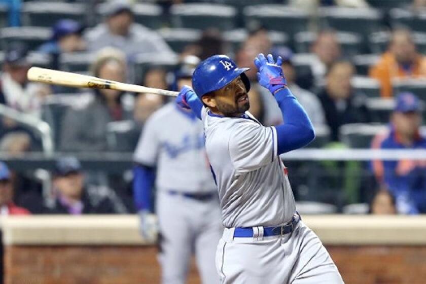 Matt Kemp eyes his first home run of the season, but the Dodgers can't hold off the Mets and lose,7-3, in the 10th inning on a grand slam.