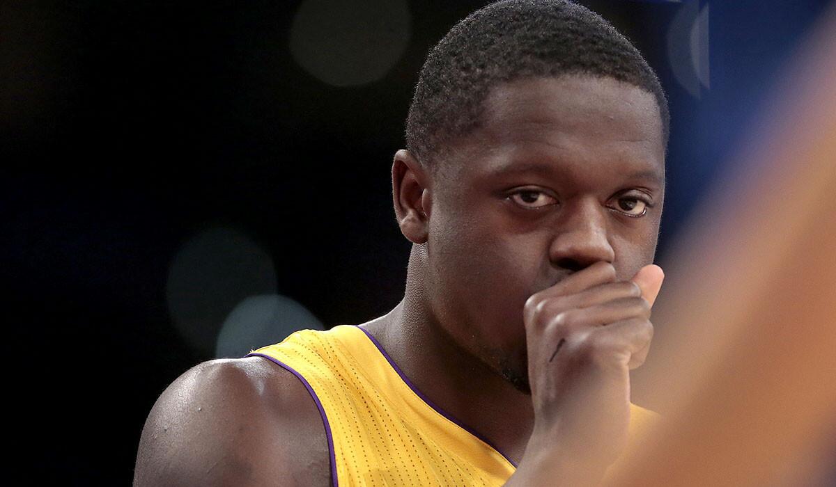 Lakers rookie forward Julius Randle relaxes during a break in play in an exhibition game against the Golden State Warriors at Staples Center on Oct. 9.