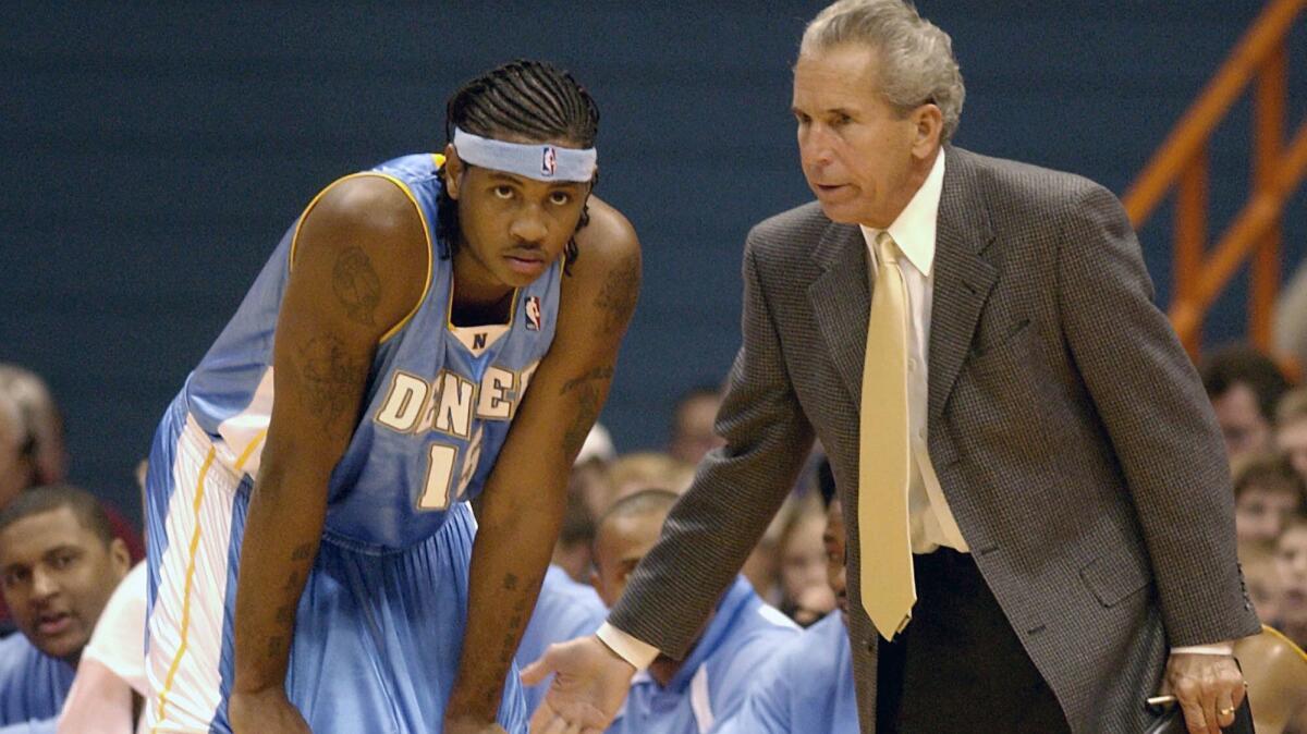 John MacLeod, then an assistant coach with the Denver Nuggests, instructs Carmelo Anthony in 2003.