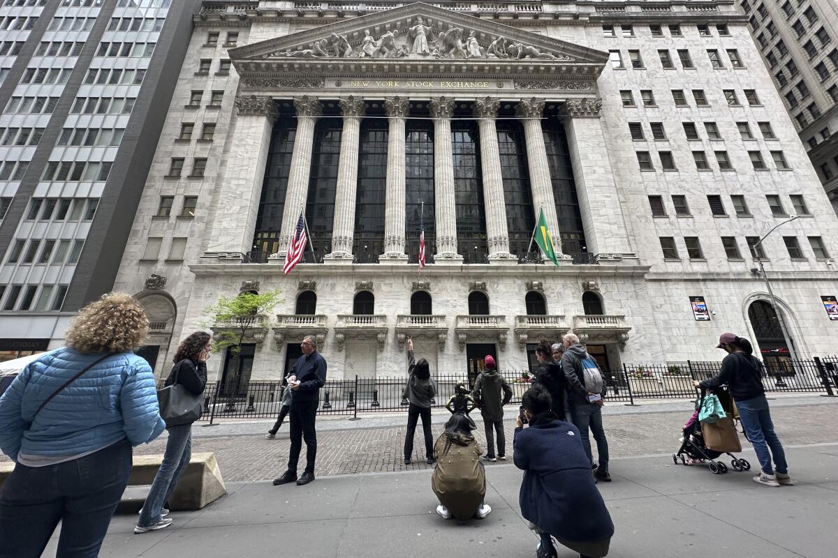  Tourists gather near the New York Stock Exchange