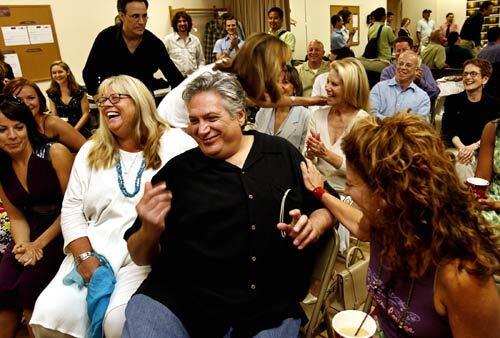 Cast members Leslie Kritzer, far left, Heather MacRae, Harvey Fierstein (who is also the show's co-producer and librettist) and Lori Wilner come together during the first day of rehearsal in New York for "A Catered Affair." The musical's pre-Broadway run is at San Diego's Old Globe Theatre through Oct. 28.