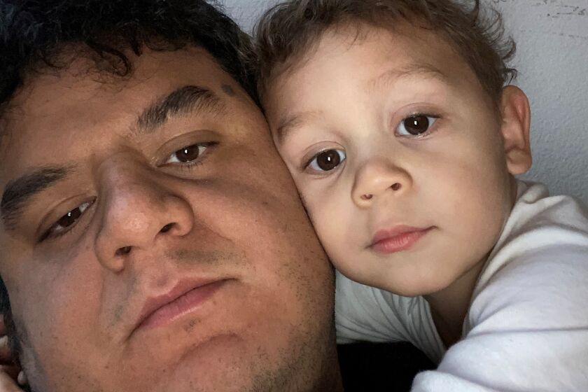 Cesar Quintana poses with his son Alexander Quintana in an undated photo