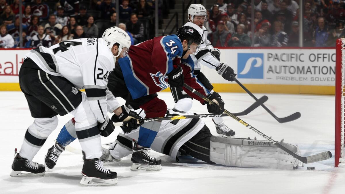 Colorado Avalanche center Carl Soderberg, second from front, tries to score a goal as, from front to back, Kings defenseman Derek Forbort, goaltender Jack Campbell and right wing Tyler Toffoli defend in the third period.