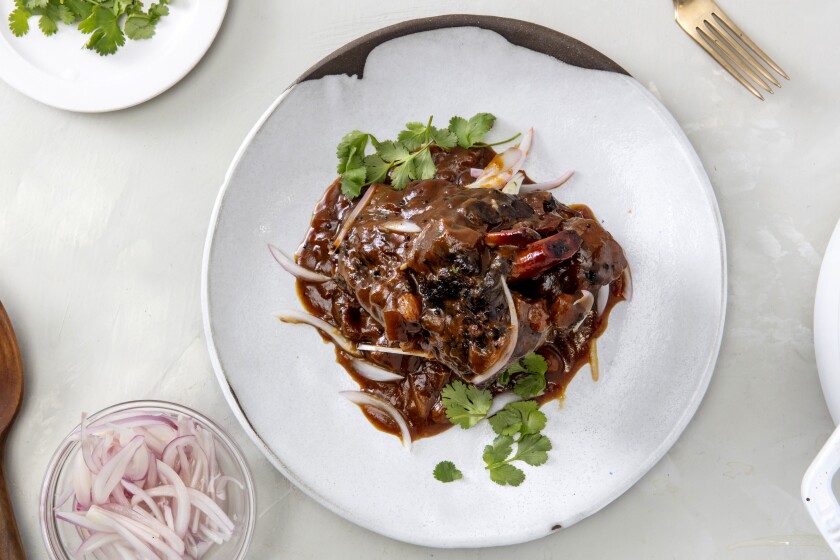 LOS ANGELES, CALIFORNIA - Feb. 27, 2020: A plate of Sticky-Sour Tamarind Lamb Shank, a recipe by Ben Mims, photographed on Thursday, Feb. 27, 2020, at the PropLink Studio in Arts District, Los Angeles. Prop styling by Rebecca Buenik (Silvia Razgova / For The Times) Assignment ID: 498232