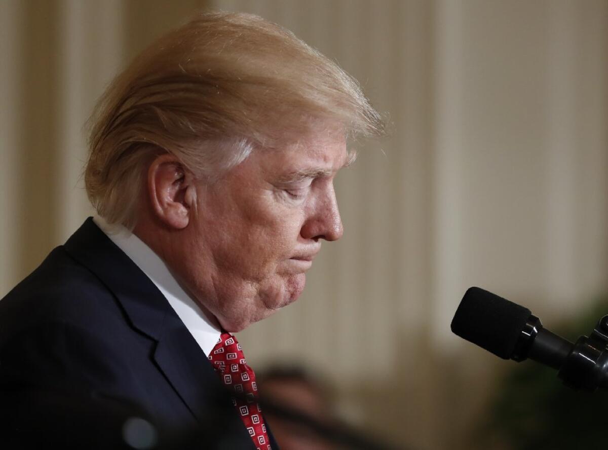 President Trump pauses during a new conference with Japanese Prime Minister Shinzo Abe at the White House on Friday.