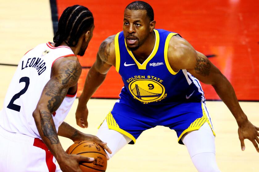 TORONTO, ONTARIO - MAY 30: Kawhi Leonard #2 of the Toronto Raptors Warriors is defended by Andre Iguodala #9 of the Golden State Warriors in the second half during Game One of the 2019 NBA Finals at Scotiabank Arena on May 30, 2019 in Toronto, Canada. NOTE TO USER: User expressly acknowledges and agrees that, by downloading and or using this photograph, User is consenting to the terms and conditions of the Getty Images License Agreement. (Photo by Vaughn Ridley/Getty Images) ** OUTS - ELSENT, FPG, CM - OUTS * NM, PH, VA if sourced by CT, LA or MoD **