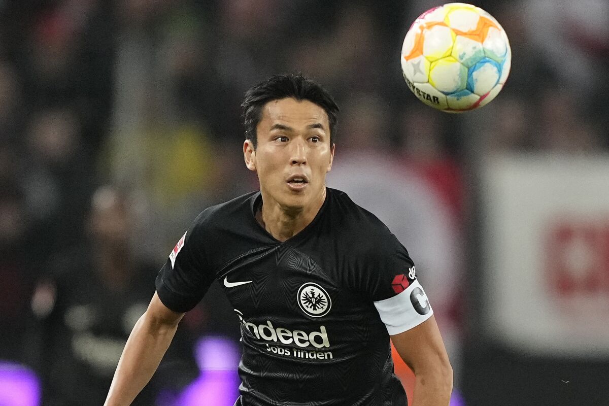 FILE - Frankfurt's Makoto Hasebe plays during the German Bundesliga soccer match between 1.FC Cologne and Eintracht Frankfurt in Cologne, Germany, on Feb. 12, 2023. Frankfurt said Tuesday March 21, 2023 that the 39-year-old Hasebe has a new contract with the club to 2027 and that he’ll take on a coaching role whenever he finally decides to quit as a player. (AP Photo/Martin Meissner, File)