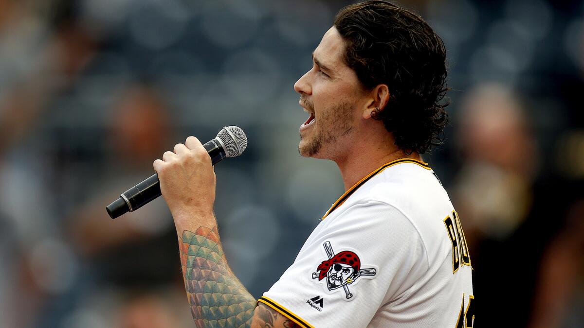 In this file photo from 2018, San Diego native and Pittsburgh Pirates pitcher Steven Brault sings the National Anthem before a game against the Milwaukee Brewers. Brault has released a debut album of show-tunes appropriately titled "A Pitch at Broadway."