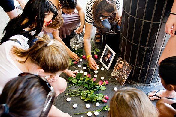 Swedish girls lay flowers and light candles in memory of Michael Jackson at Sergel square in central Stockholm.