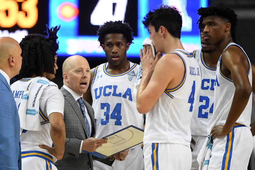 LOS ANGELES, CA - FEBRUARY 29: Tyger Campbell #10, David Singleton #34, Jaime Jaquez Jr. #4, Jalen Hill #24 and Chris Smith #5 of the UCLA Bruins listen as head coach Mick Cronin talks during a timeout in the second half of the game against the Arizona Wildcats at Pauley Pavilion on February 29, 2020 in Los Angeles, California. (Photo by Jayne Kamin-Oncea/Getty Images)