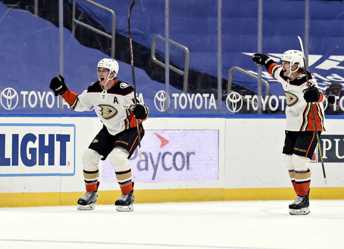 Anaheim Ducks' Josh Manson (42) reacts after scoring the game winning goal against the St. Louis Blues.