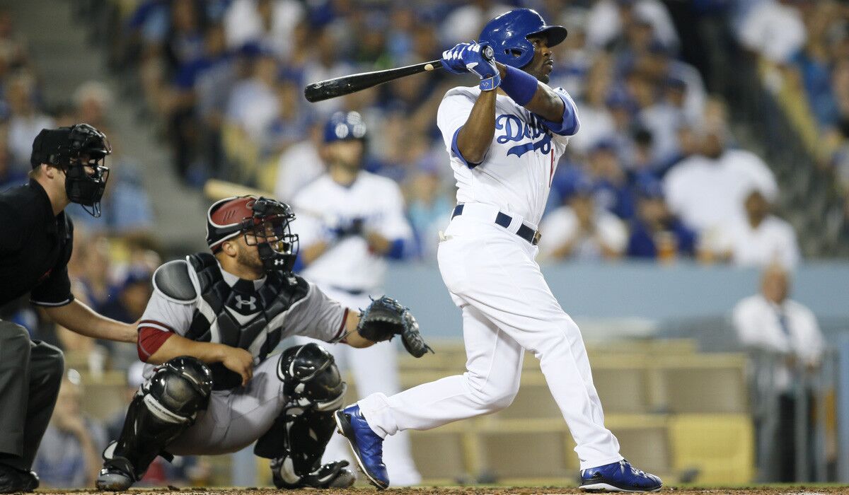 Los Angeles Dodgers shortstop Jimmy Rollins hits a three-run home run in front of Arizona Diamondbacks catcher Welington Castillo to score Alex Guerrero and Andre Ethier during the fourth inning on Monday.