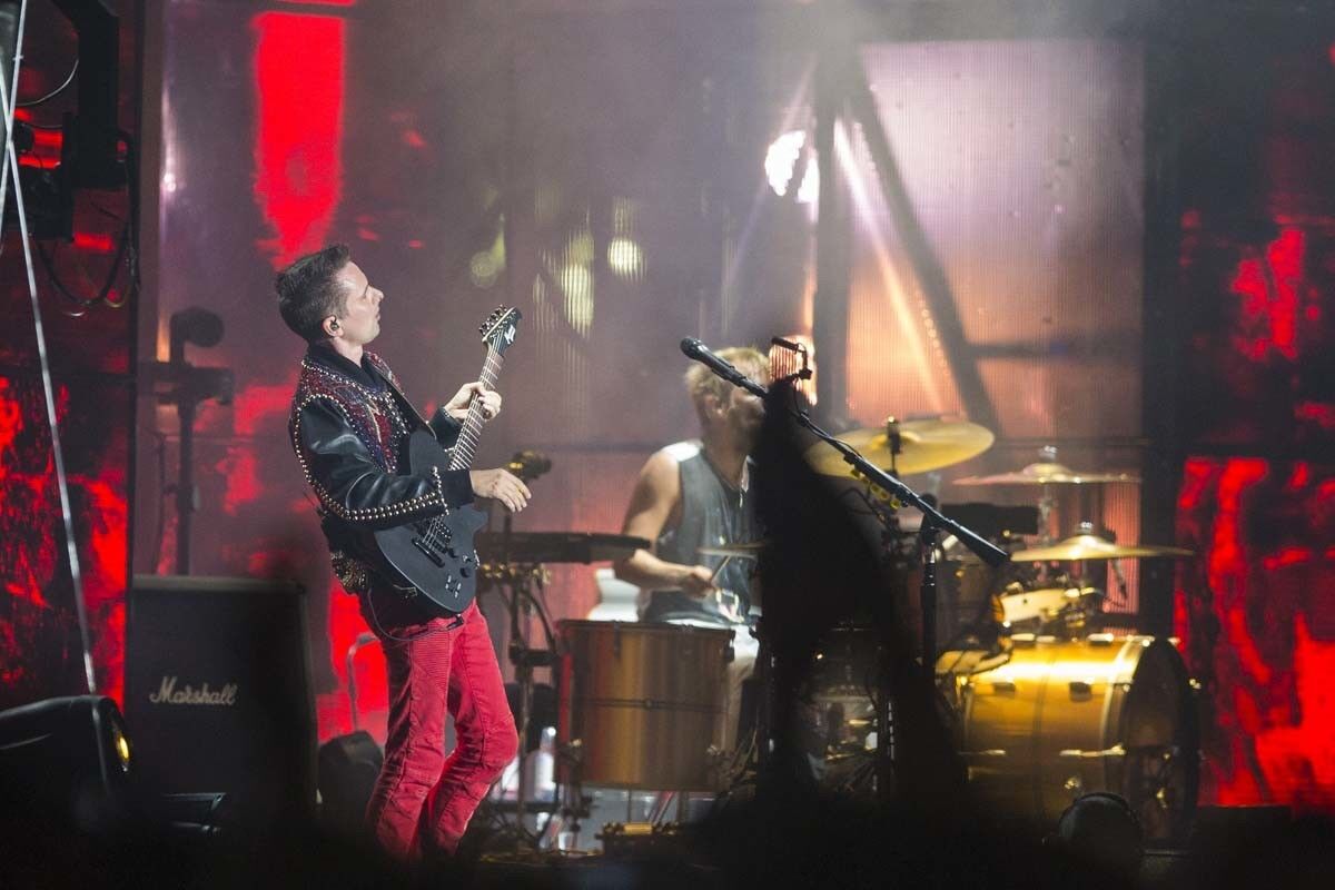 Muse lead singer Matt Bellamy performs on the Grandview Stage on Saturday evening.