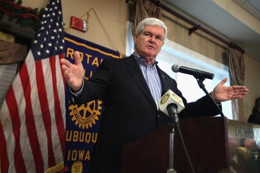 Newt Gingrich addresses a meeting of the Rotary Club during a campaign stop at the Dubuque Golf and Country Club.