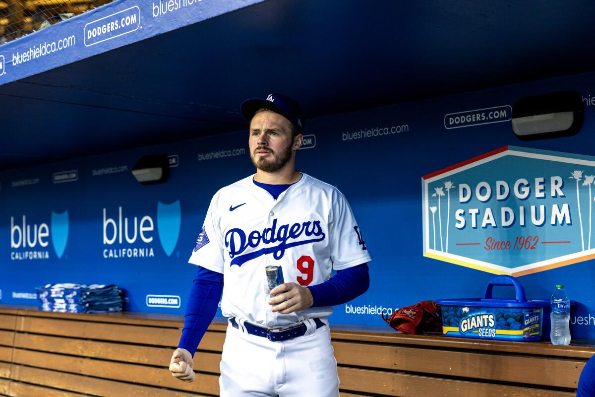  Gavin Lux stands in the dugout at Dodger Stadium.