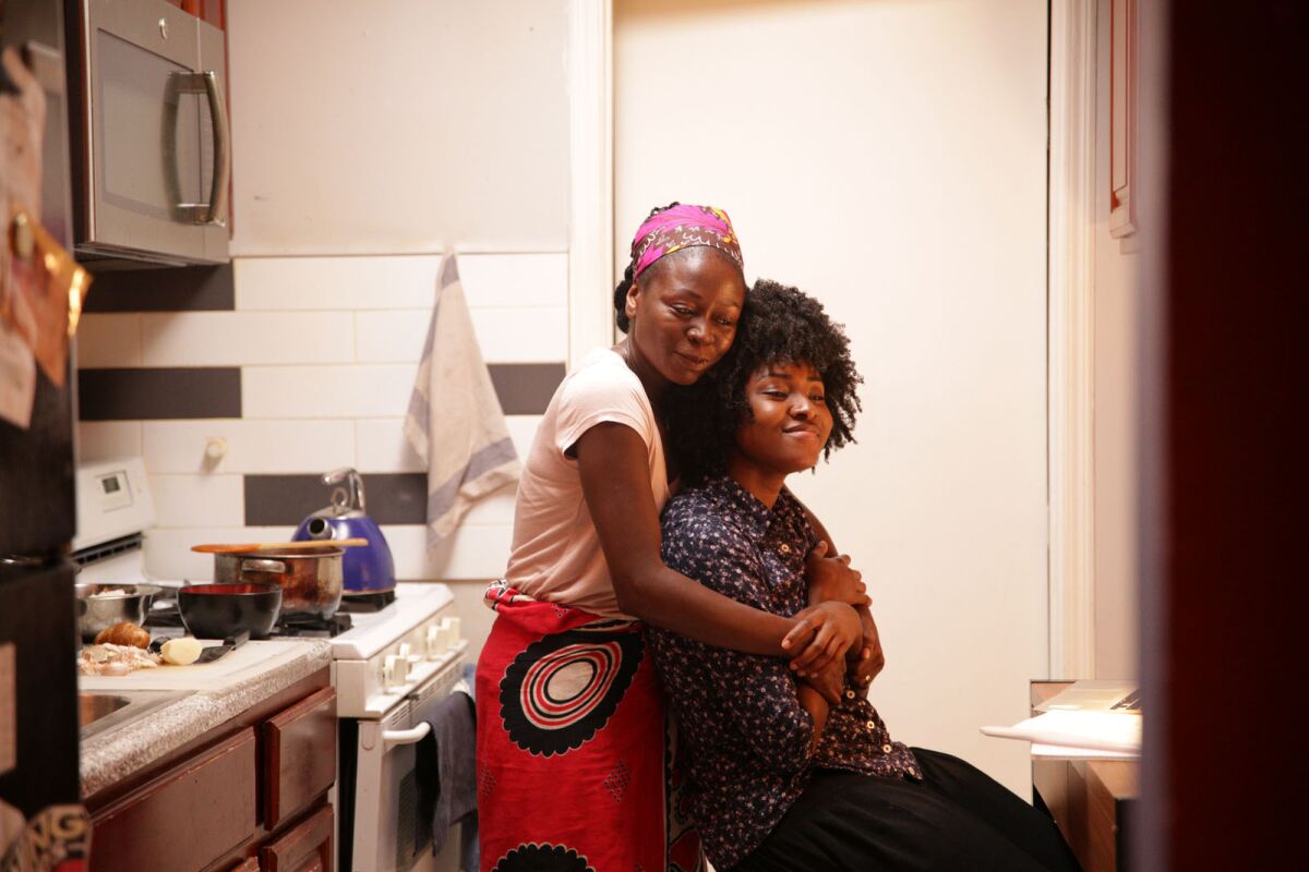 Zainab Jah embraces Jayme Lawson, who plays her daughter in the movie "Farewell Amor."