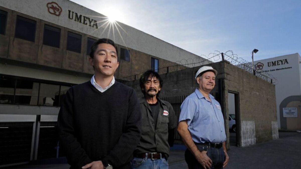 Rex Hamano, left, is the third generation to run Umeya Rice Cake Co. in Los Angeles. With him are longtime workers Clemence Santos, center, and Adan Medina. The company will be closing at the end of the year after 92 years in business.