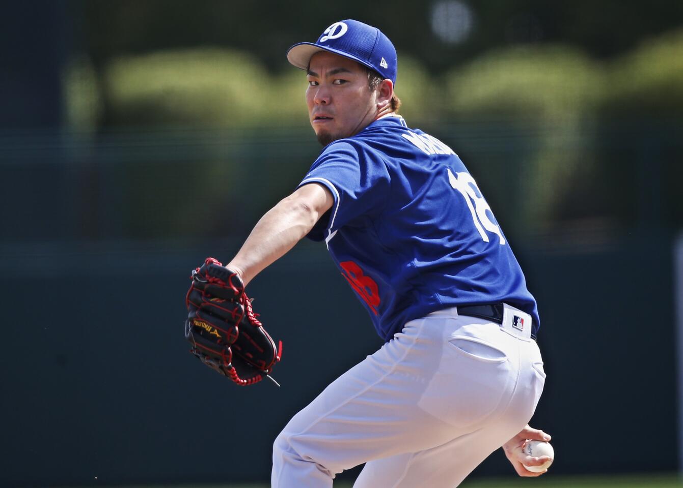 Los Angeles Dodgers pitcher Kenta Maeda pitches during a spring training baseball game against the Seattle Mariners Saturday, March 9, 2019, in Phoenix. (AP Photo/Sue Ogrocki)