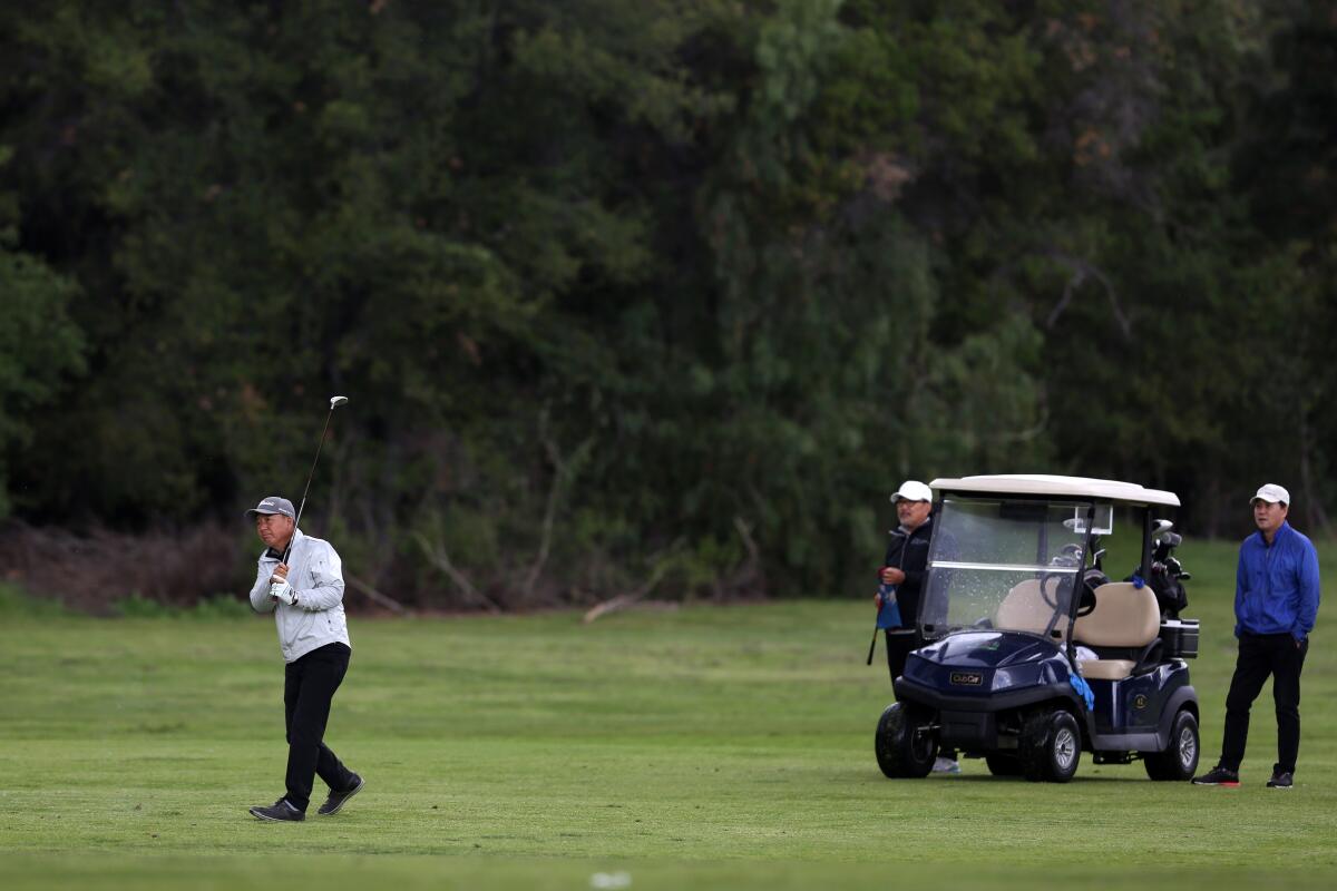 Golfers play a round at the Wilson & Harding Golf Course in Griffith Park on Thursday.