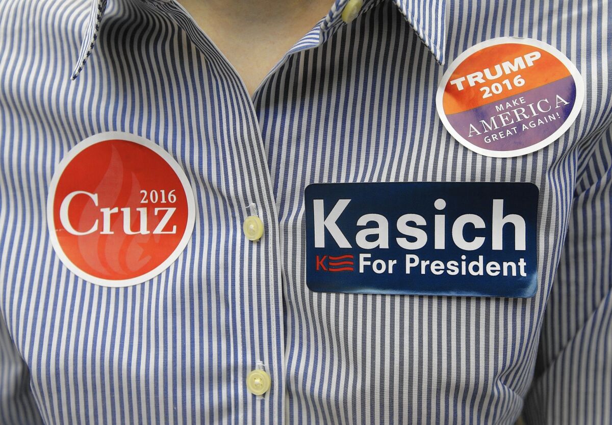 At least one attendee appeared noncommittal at the California GOP convention in Burlingame, wearing stickers for all three remaining Republican presidential candidates.